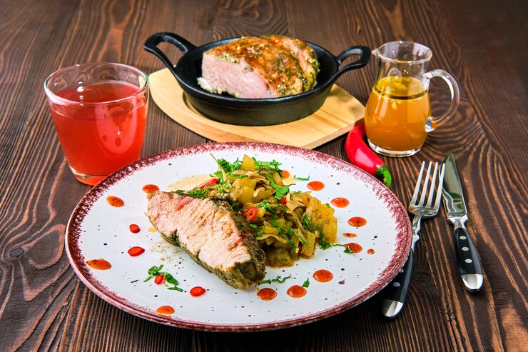 "Easy Dinner Recipes: Oven-baked meat with braised cabbage and zucchini, served with spicy sauce, a perfect homemade meal for a delicious and quick family dinner."